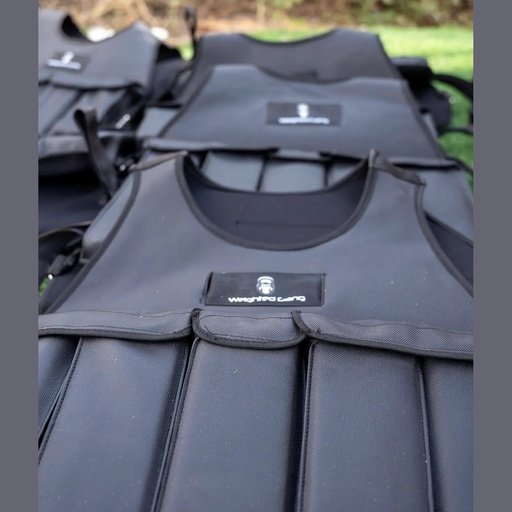 Black weighted vest with 20kg weight for strength training and workouts.